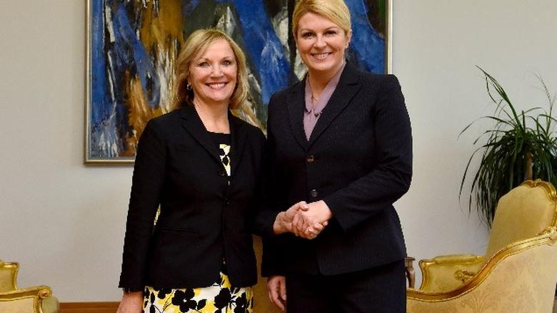 Nikki Gutgold shaking hands with President of Croatia